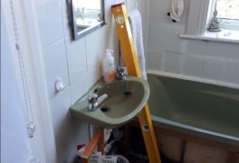 Old basin impedes the doorway