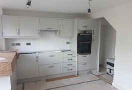 old understairs cupboard opened out to create space for oven and fridge freezer