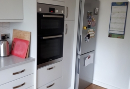 understairs modification designed to fit tall kitchen units and fridge freezer