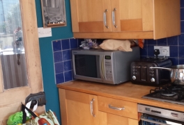 Old wood effect cabinets had loose hinges and broken drawers