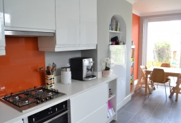Integrated Elica cooker hood hidden within wall cabinet