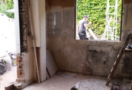 new window opening at far end; old window on left turned into doorway