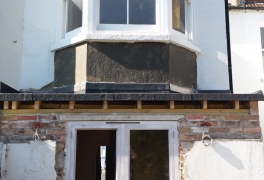 new flat roof completed and new, larger window installed